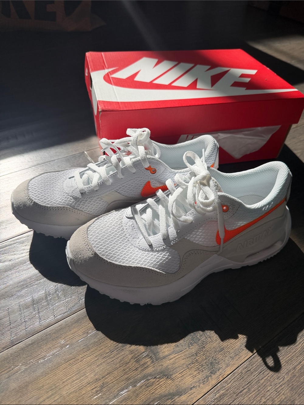 Nike White Airmax Sneakers with Orange Swoosh